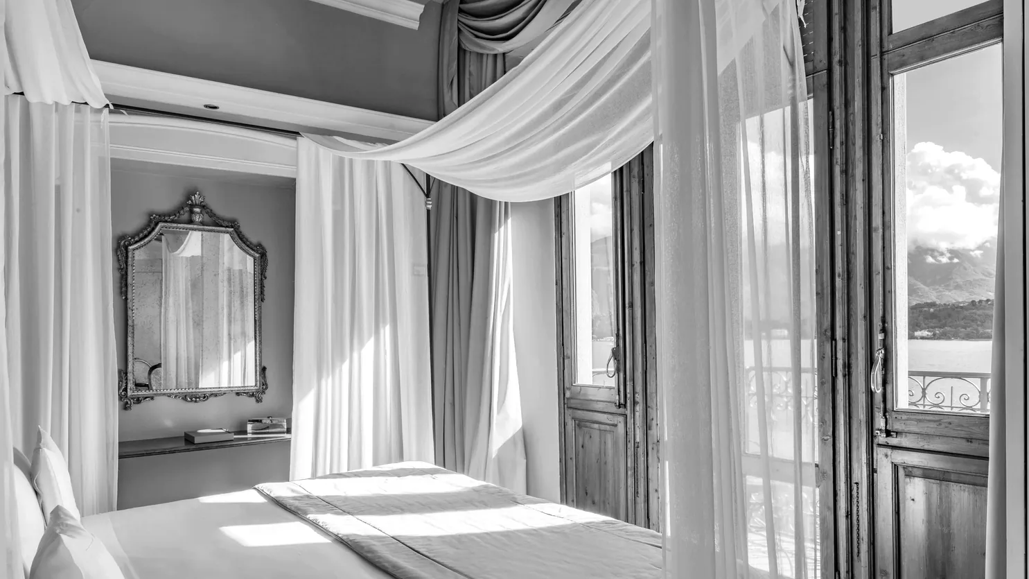 Beltrami bed linen in a made-to-measure hotel interior overlooking Lake Como
